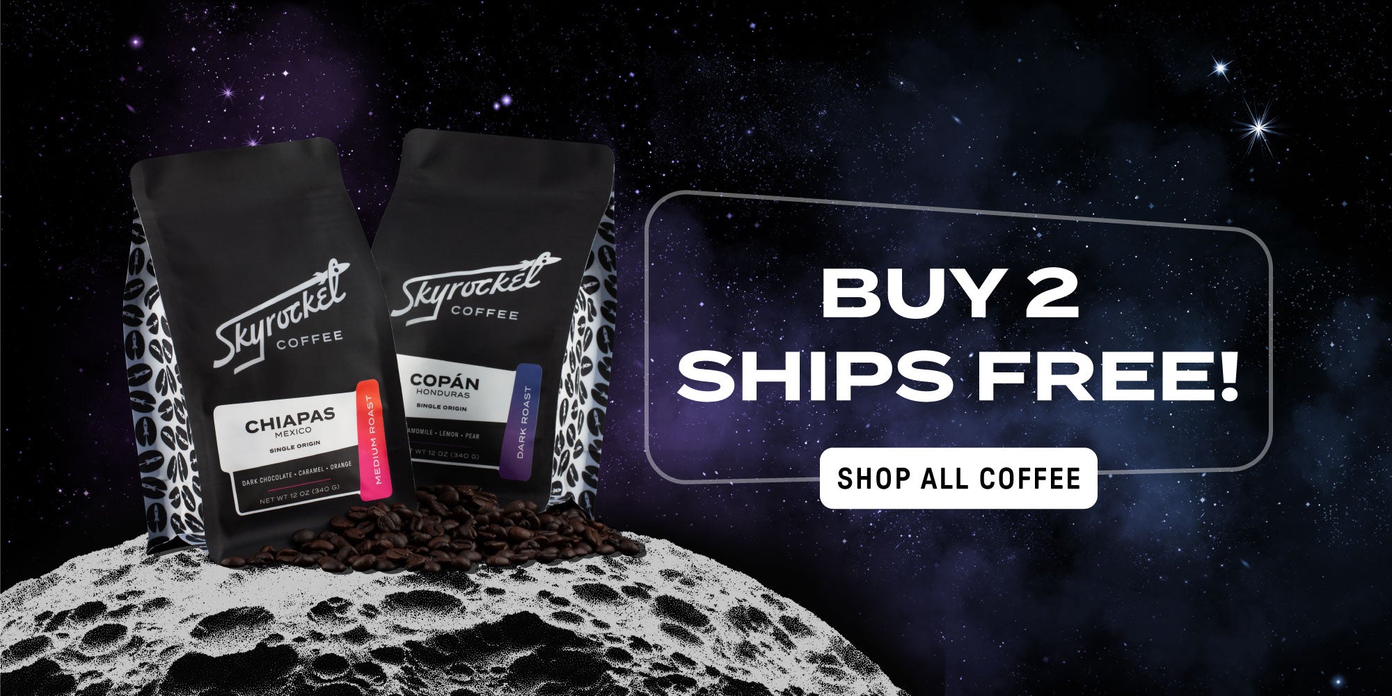 Buy 2 Ships Free! Two 12 oz Coffee bags sitting on pile of beans in space.